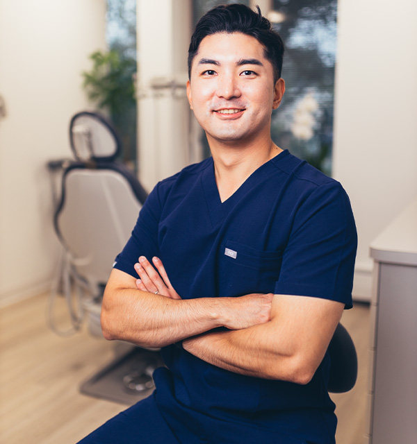 Jersey City endodontist showing a clipboard to a patient