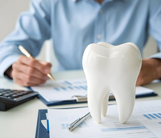 Man budgeting for the cost of dental care